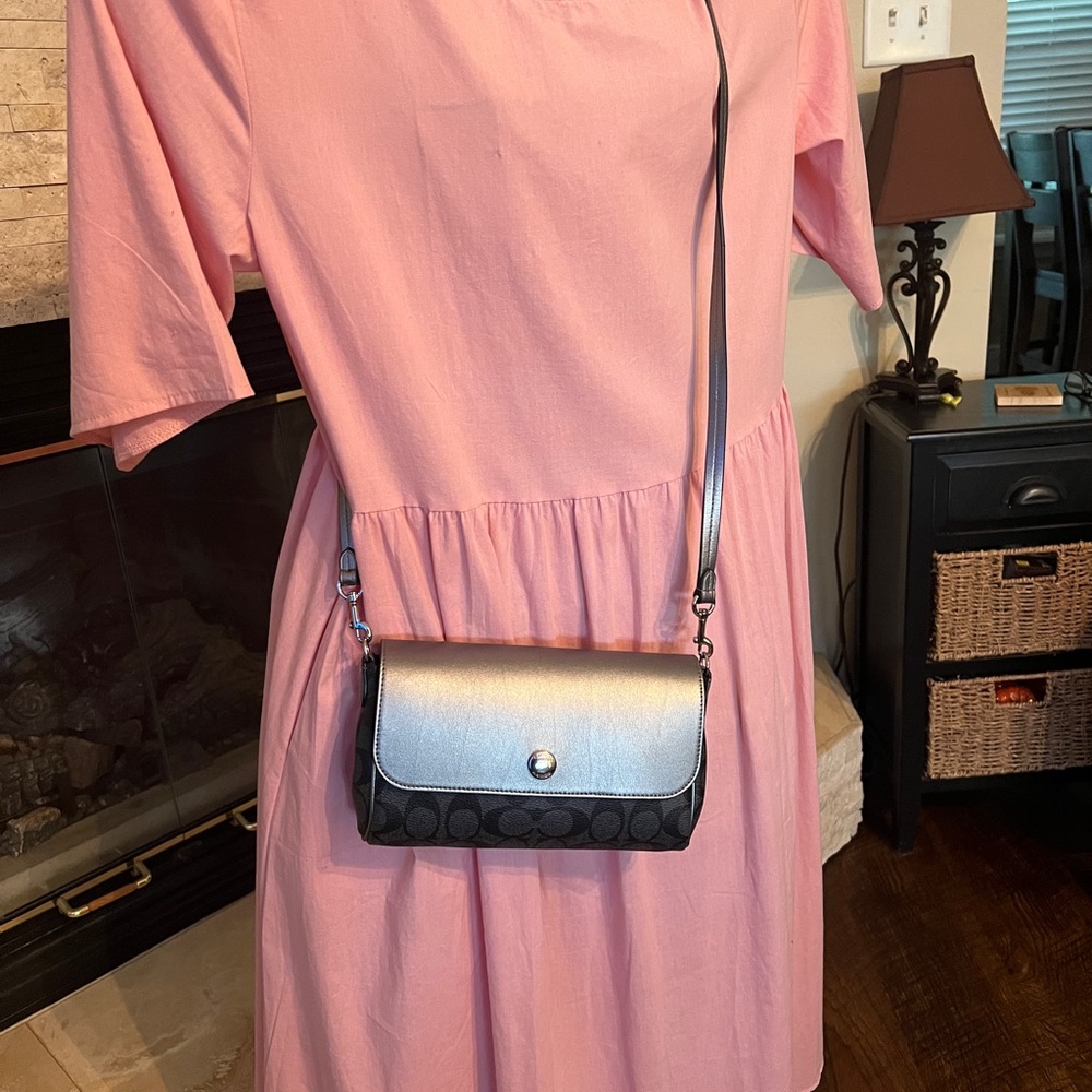 Coach black and silver reversible clutch crossbody